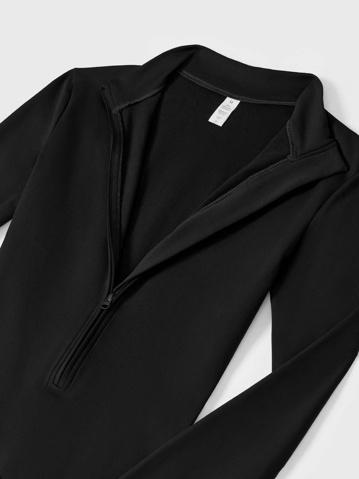 NORDÉA Winter Jumpsuit half-zip and fleece lining detail
